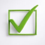 Green checkmark inside a square box representing finishing tasks and completing goals