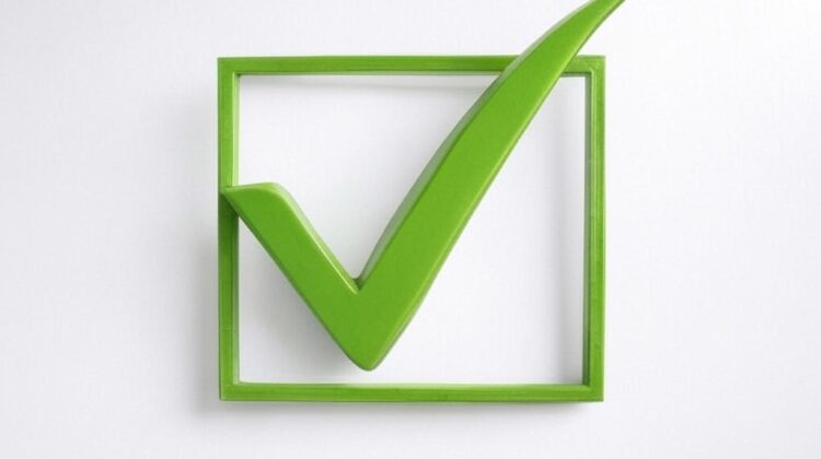 Green checkmark inside a square box representing finishing tasks and completing goals